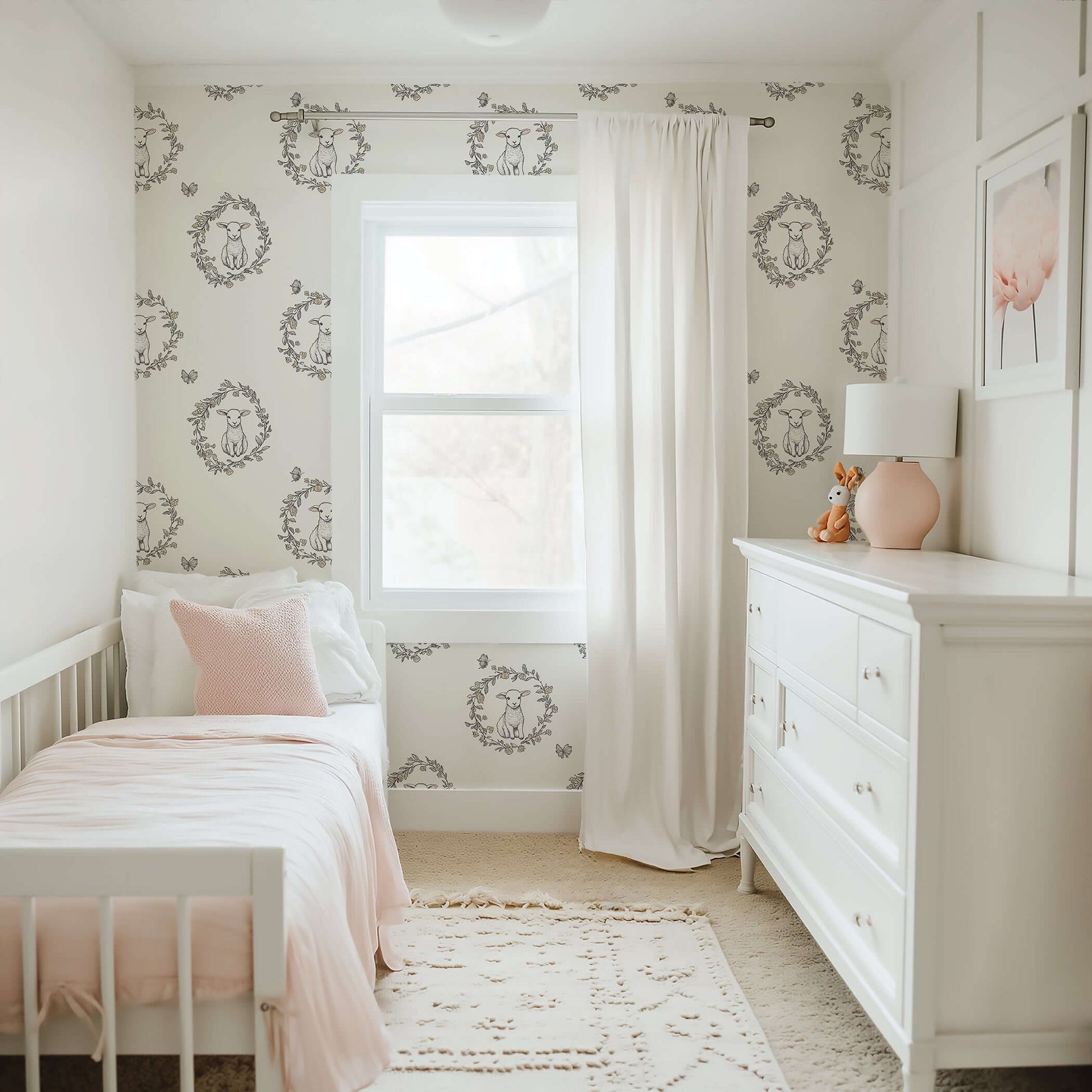 Nursery featuring Lambs Meadow Dream wallpaper with baby lambs in floral wreaths, perfect for children and playrooms, in cream tones.