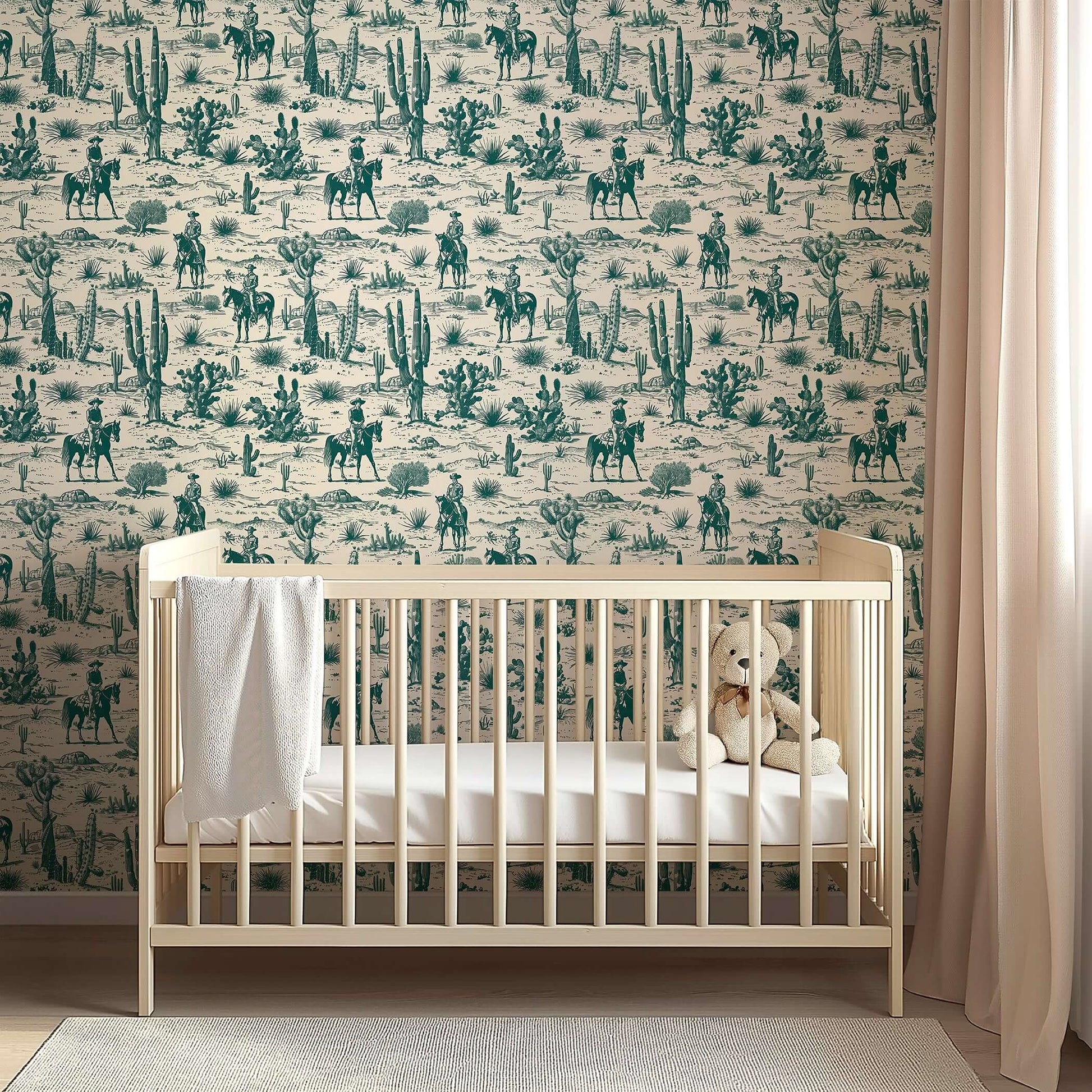 Cowboy Trails toile wallpaper with cowboys, horses, desert, and cactus design behind a crib, creating a rustic Western nursery theme.