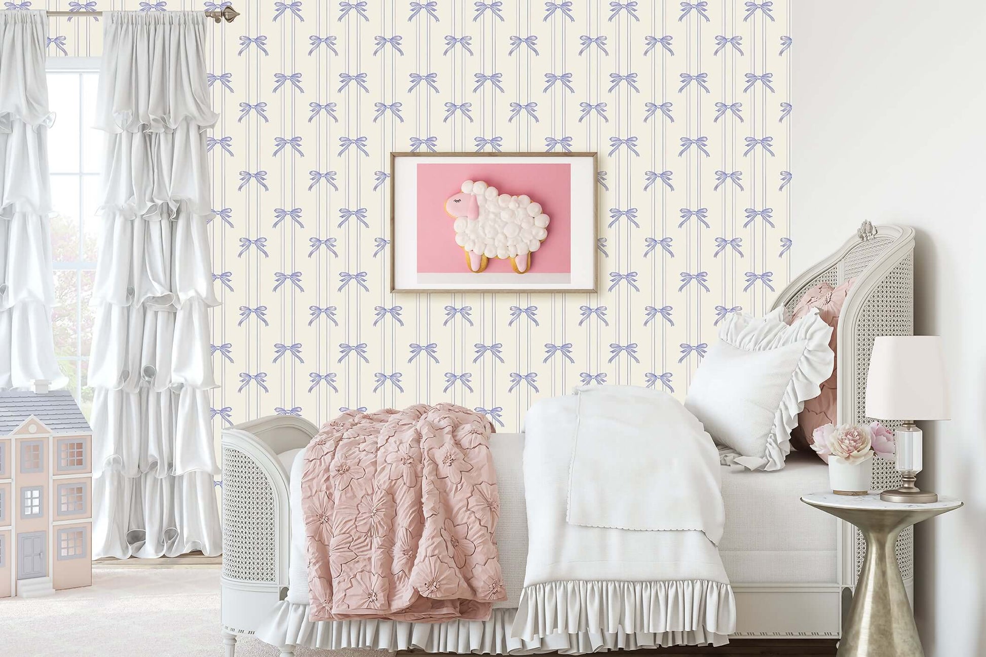 Lavender Ribbons wallpaper with bows in a nursery featuring a cozy bed and a whimsical sheep wall art.