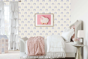 Lavender Ribbons wallpaper with bows in a nursery featuring a cozy bed and a whimsical sheep wall art.