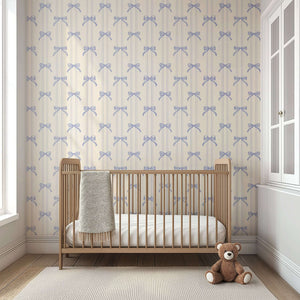 Lavender bow-tied wallpaper in nursery with crib and teddy bear, perfect vintage decor for baby rooms and children's playrooms.