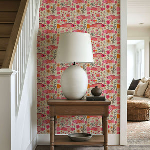 Floral Fins Wallpaper: Whimsical pink fish and vibrant garden florals in fuchsia and coral, adding coastal charm to any space.