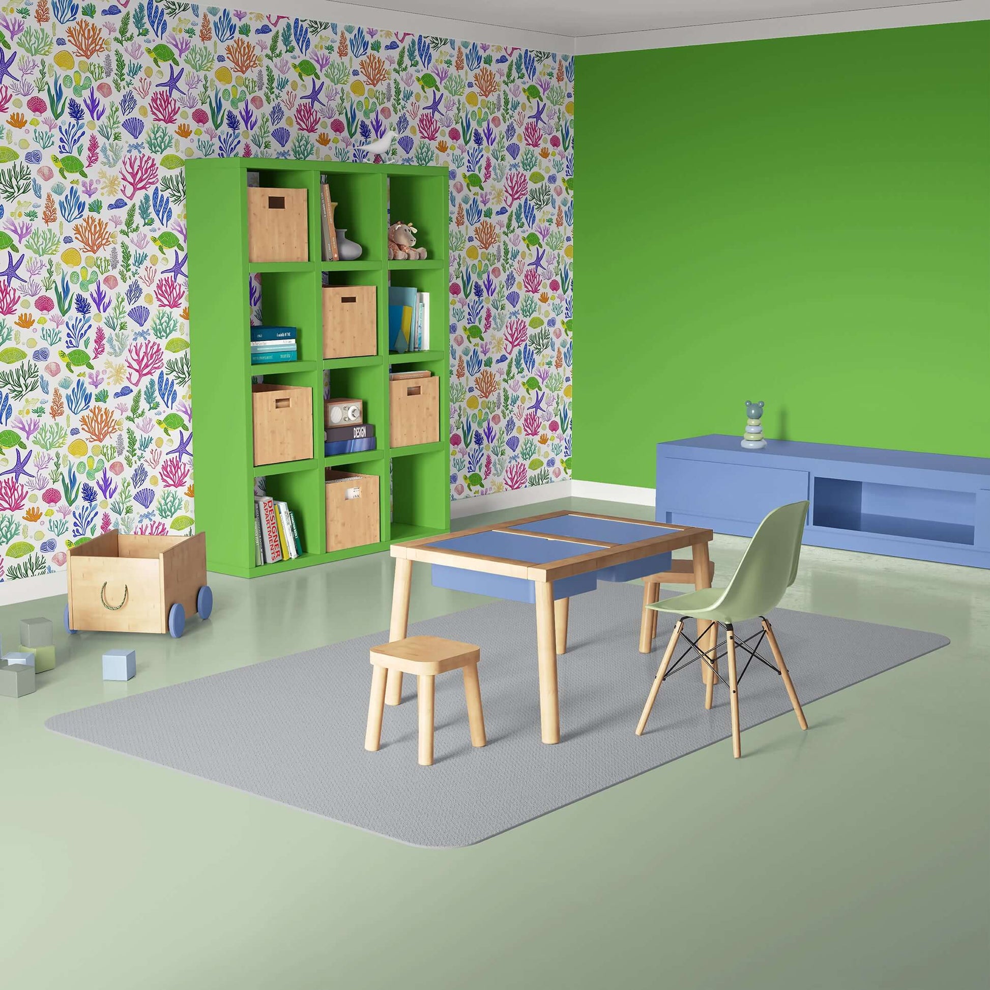 Playful kids' room with Ocean Safari fish wallpaper, green shelf, and wooden play table, perfect for nurseries and children's spaces.