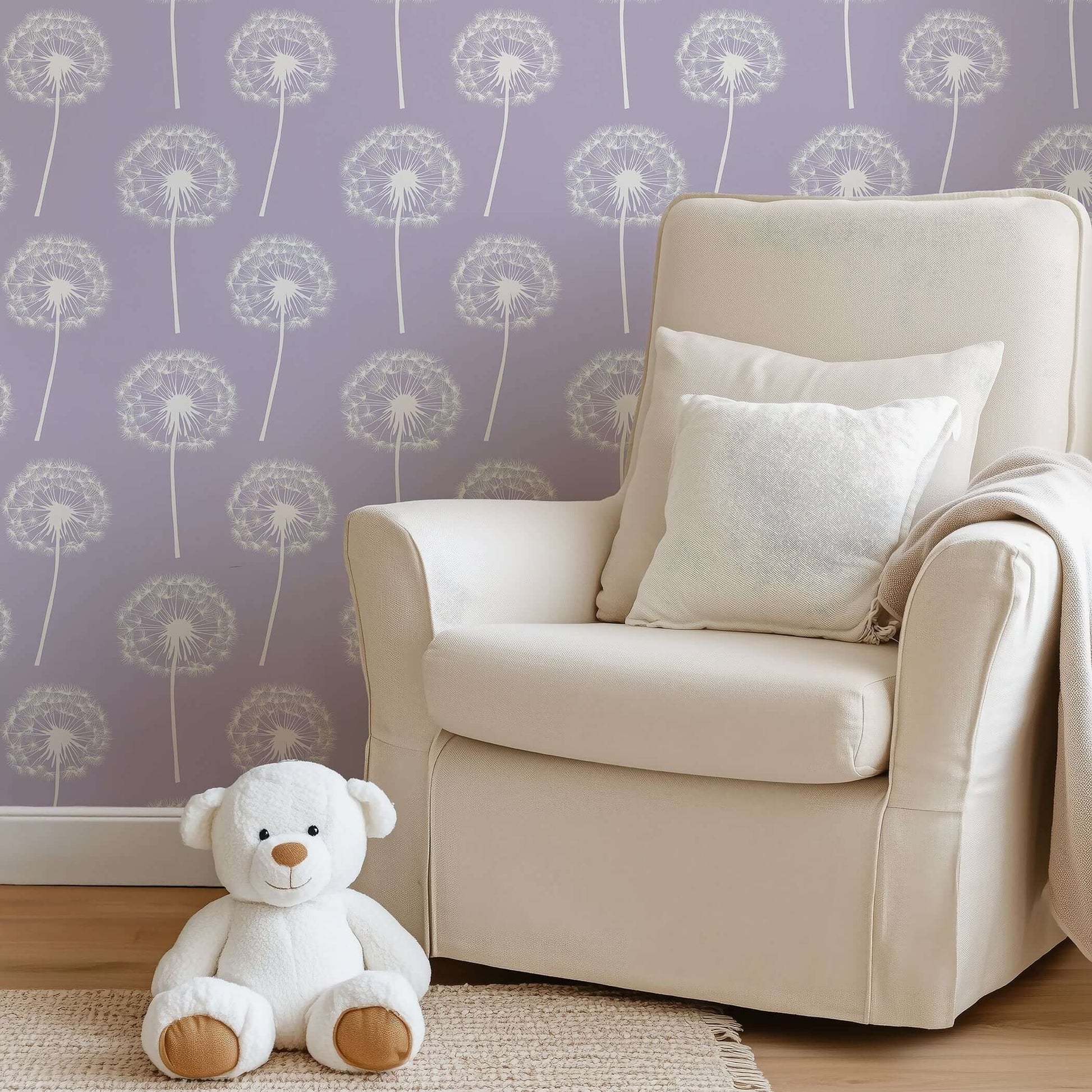 Luxe Dandelion wallpaper in nursery with lavender background, soft white dandelions, and teddy bear in cozy chair setting.