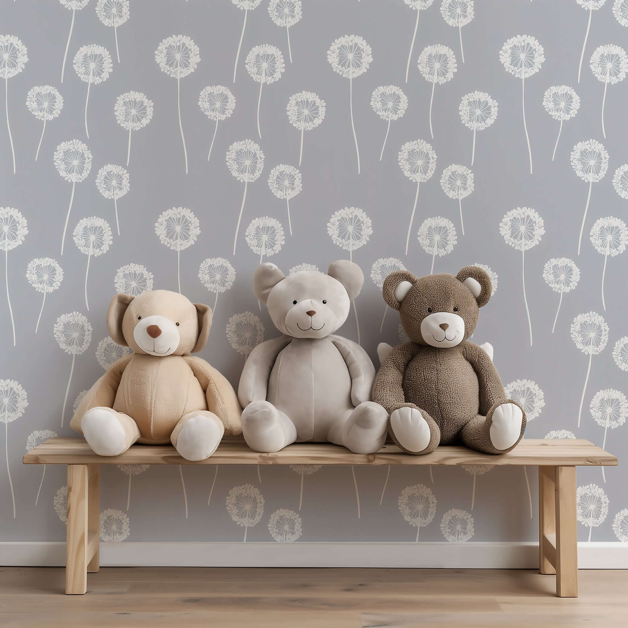 Three teddy bears sit on a bench against dandelion whimsy wallpaper, perfect for children's nursery or playroom decor.