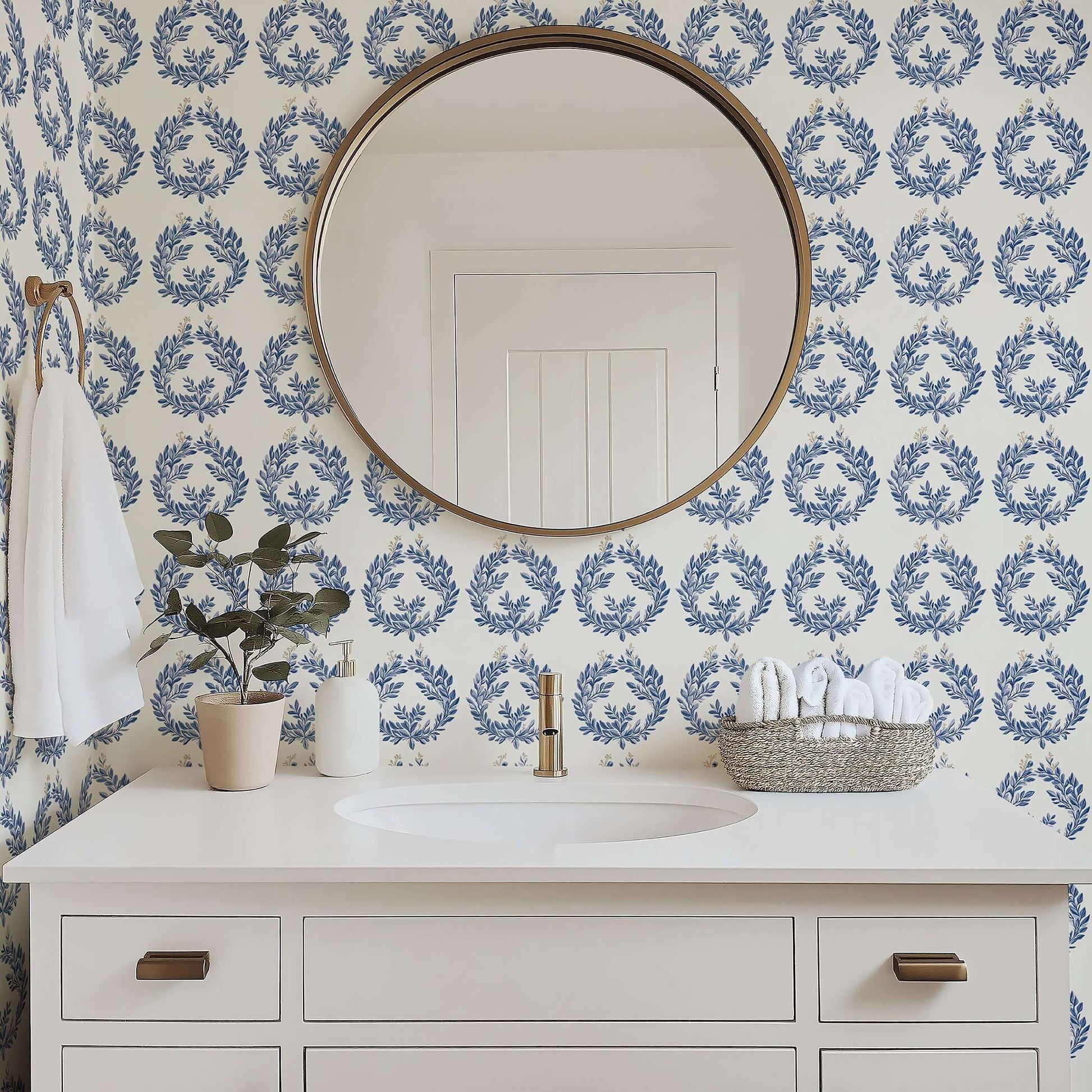 The Majestic Laurel Rings wallpaper featuring navy laurel wreaths on ivory, enhancing a bathroom with botanical luxury.