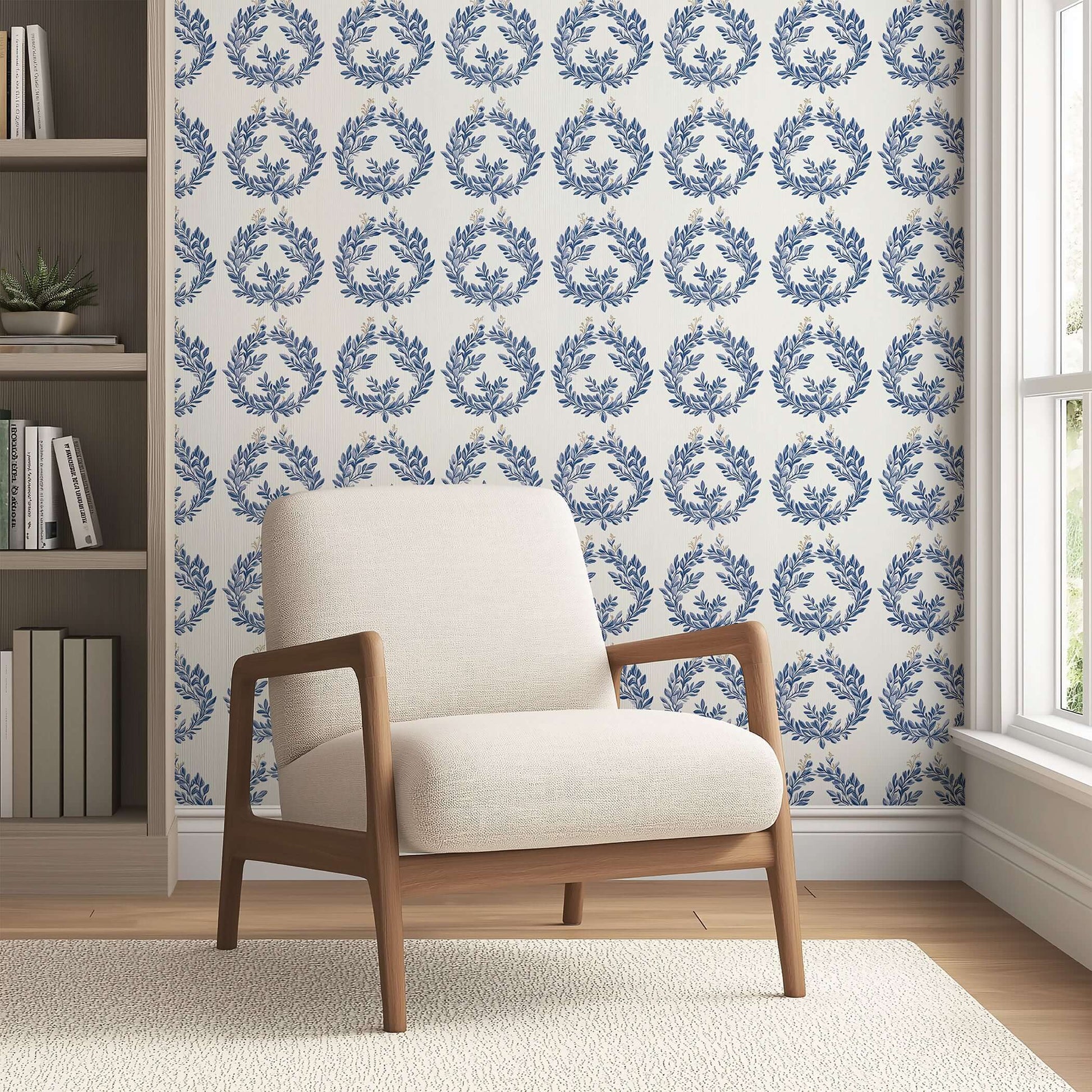 Elegant room with navy laurel wreath wallpaper, ivory armchair, and light-filled window, showcasing botanical luxury and classic design.