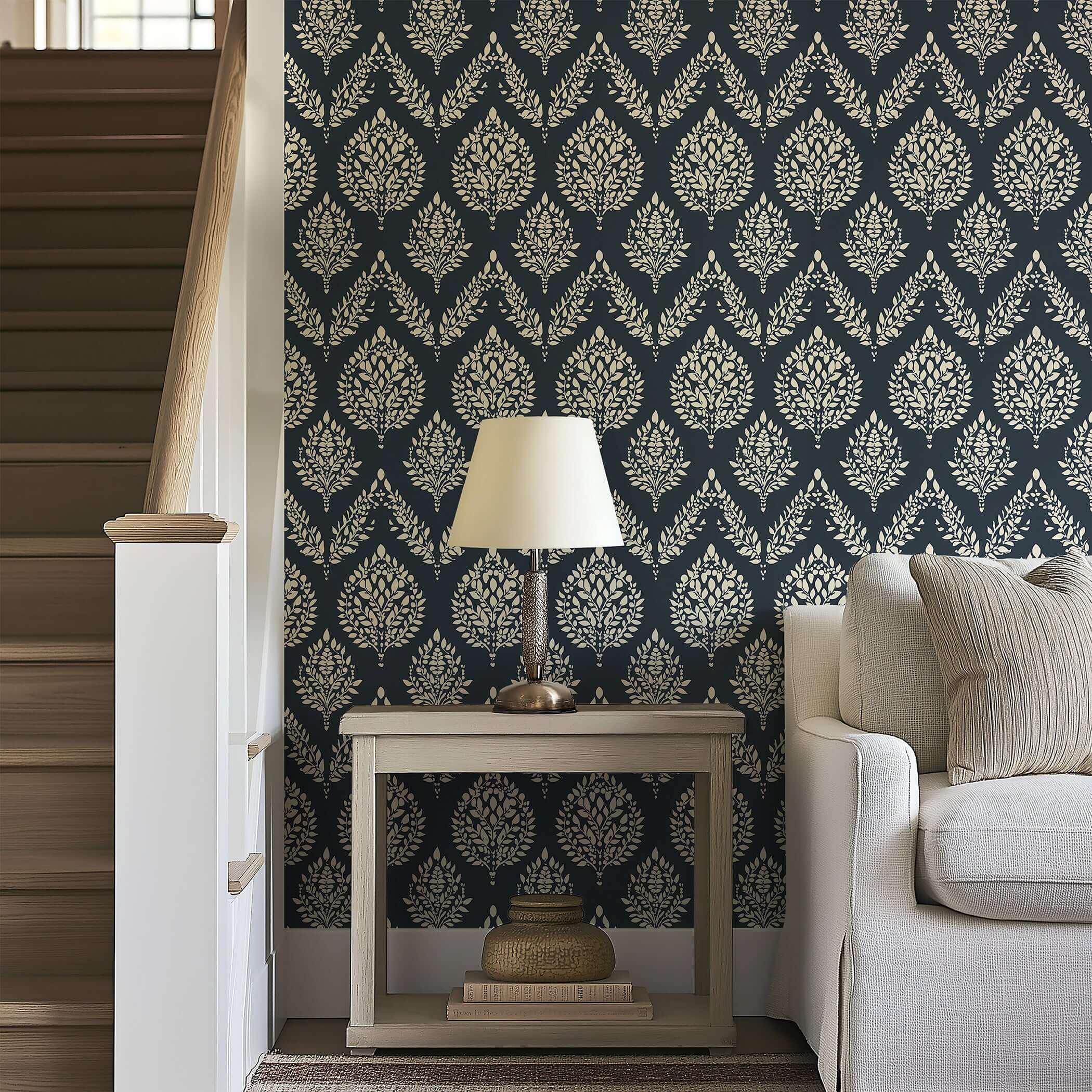 Heritage Flora wallpaper with laurel rings and damask design in ivory on charcoal, enhancing a cozy living space with vintage charm.
