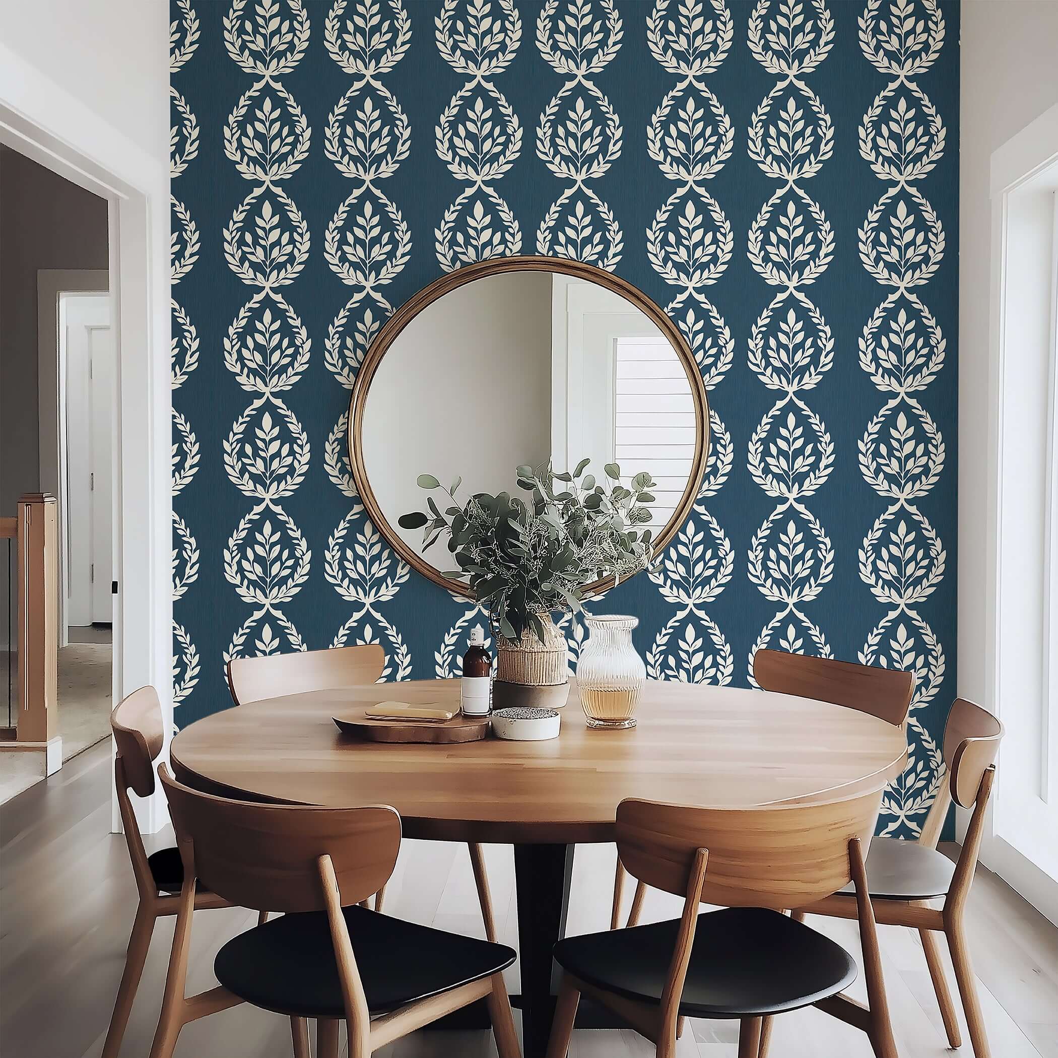 Navy Heritage Wreath Wallpaper with ivory laurel wreaths, adding traditional elegance to a dining room setting.