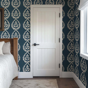 Navy Heritage Wreath wallpaper with laurel wreath pattern, enhancing traditional decor with elegant contrast of ivory florals on navy.