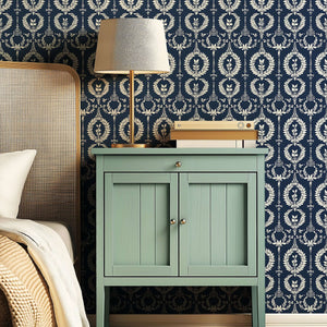 Nobility Wreath wallpaper featuring ivory laurel wreaths on navy, enhancing traditional decor with florals and elegance.