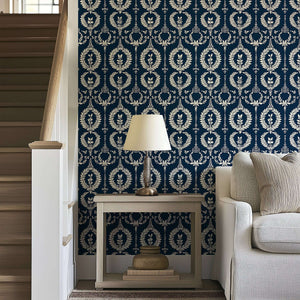 Nobility Wreath Wallpaper with ivory laurel wreaths on a navy background, enhancing traditional décor with florals and elegance.