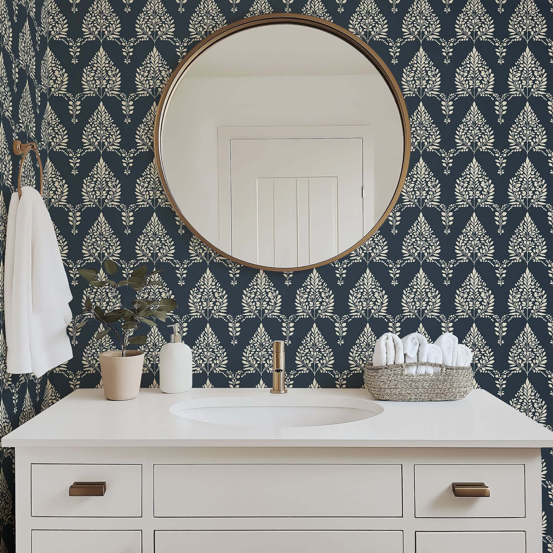 Noir Bloom wallpaper in a bathroom setting, featuring creamy floral laurels and laurel wreaths against a charcoal background.