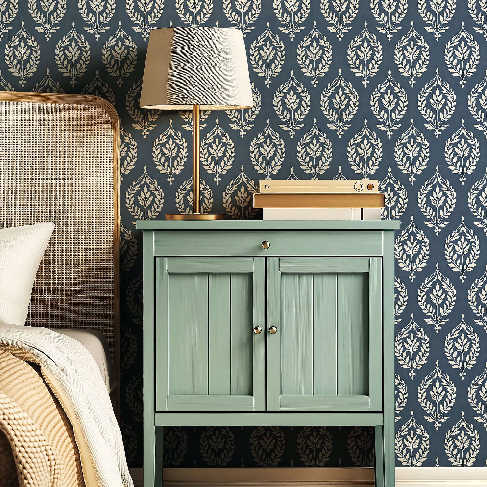 Traditional wallpaper with slate blue and ivory laurel wreath motifs brings vintage charm and elegance to home interiors.