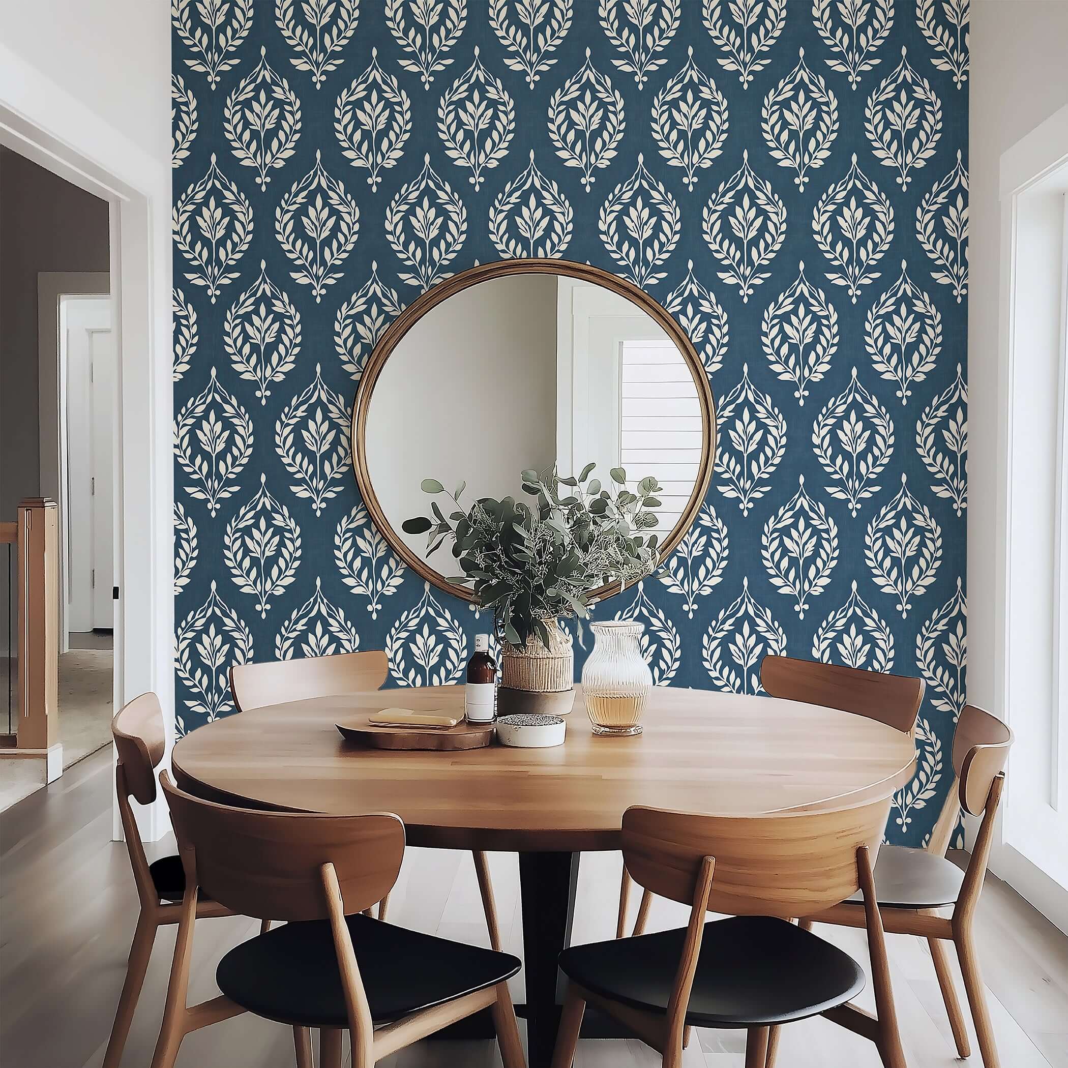 Dining room with Vintage Laurel Charm wallpaper featuring ivory laurel wreath motifs on slate blue, enhancing elegance and tradition.