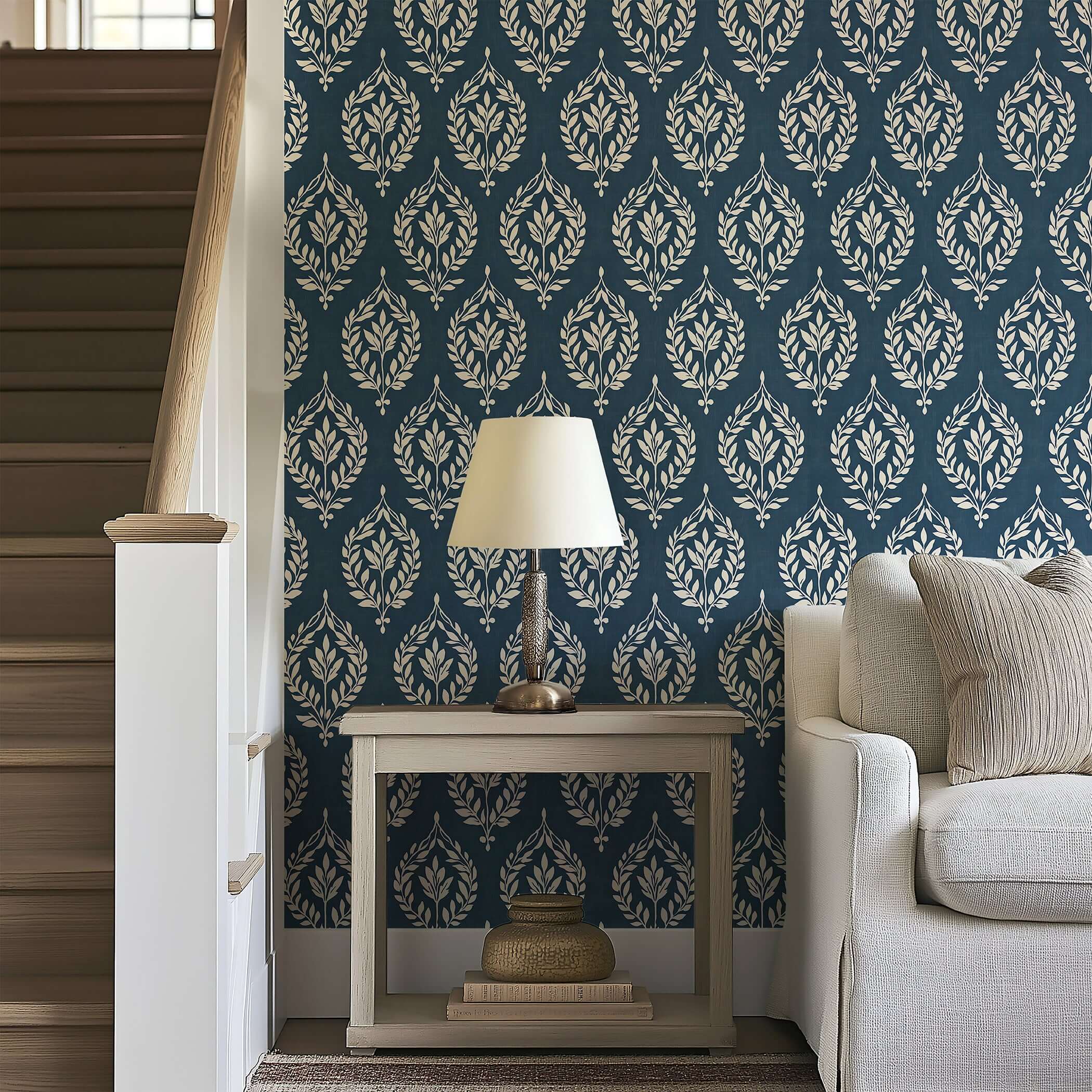 Classic slate blue wallpaper with ivory laurel wreath motifs, adding traditional elegance and floral charm to home interiors.