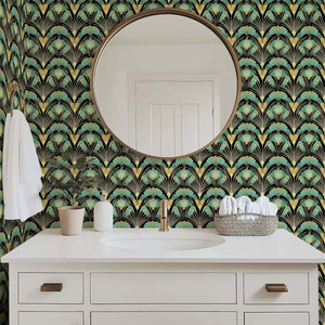 Art Deco wallpaper with jade and gold fan motifs on black wall behind bathroom vanity, mirror, and decor for vintage elegance.