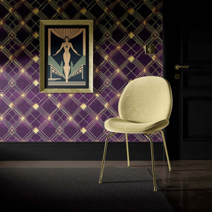 Deco Diamond Noir wallpaper with art deco design in plum and gold, featuring geometric diamond patterns and a vintage framed poster.