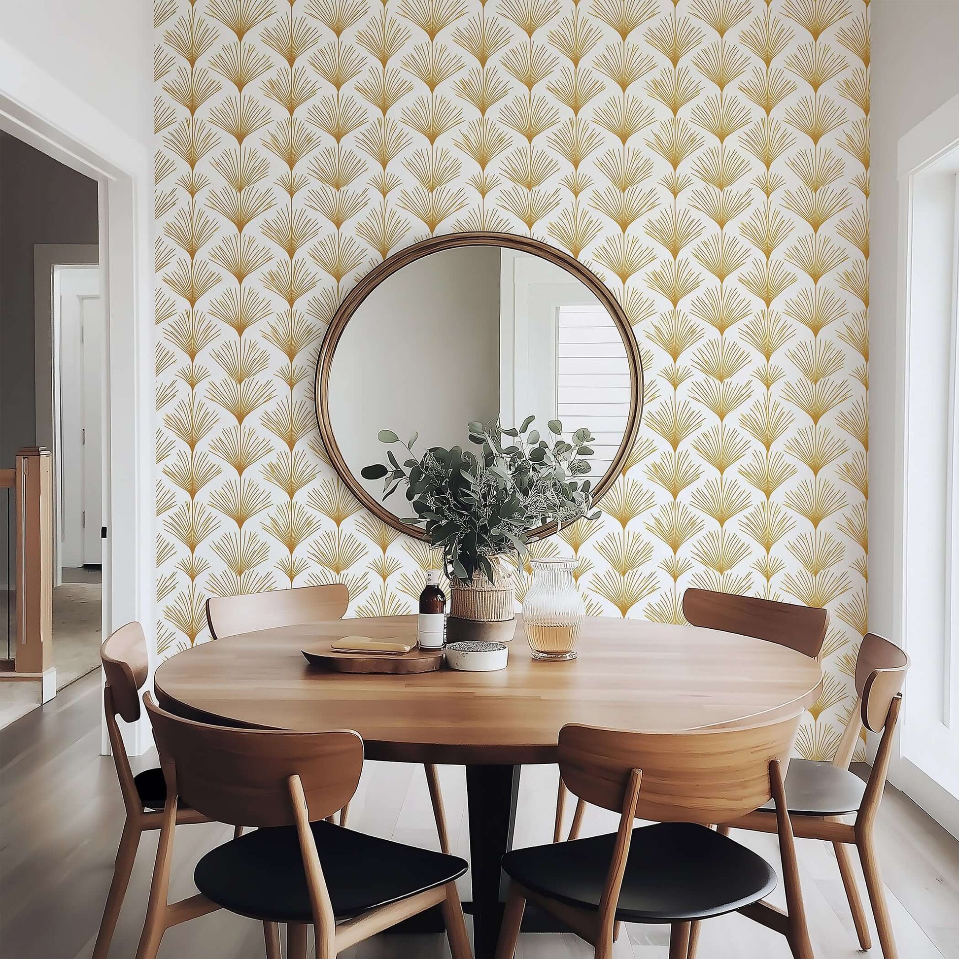 Dining room with Art Deco inspired "Golden Deco Fan" wallpaper featuring gold fan patterns on a white background and wooden furniture.