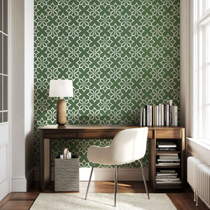 Modern geometric wallpaper with white floral tile design on sage green background, perfect for accent walls in living spaces.