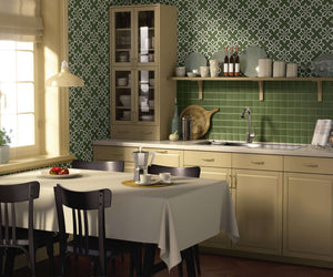 Modern kitchen with Nature's Geometry wallpaper featuring white geometric floral tiles on a sage green background.