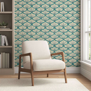 Art Deco coastal wallpaper with teal and cream fan motifs enhancing a cozy living room setting.