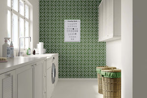 Laundry room with Verdant Minimalism wallpaper featuring geometric floral design in sage green and white, modern tile-like pattern.