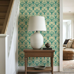 Art Deco coastal wallpaper with teal fan motifs on a sandy background, enhancing elegance and texture in a modern room setting.