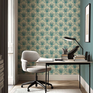 Art Deco teal and cream wallpaper with fan motifs, creating a coastal-inspired accent wall in a stylish home office setting.