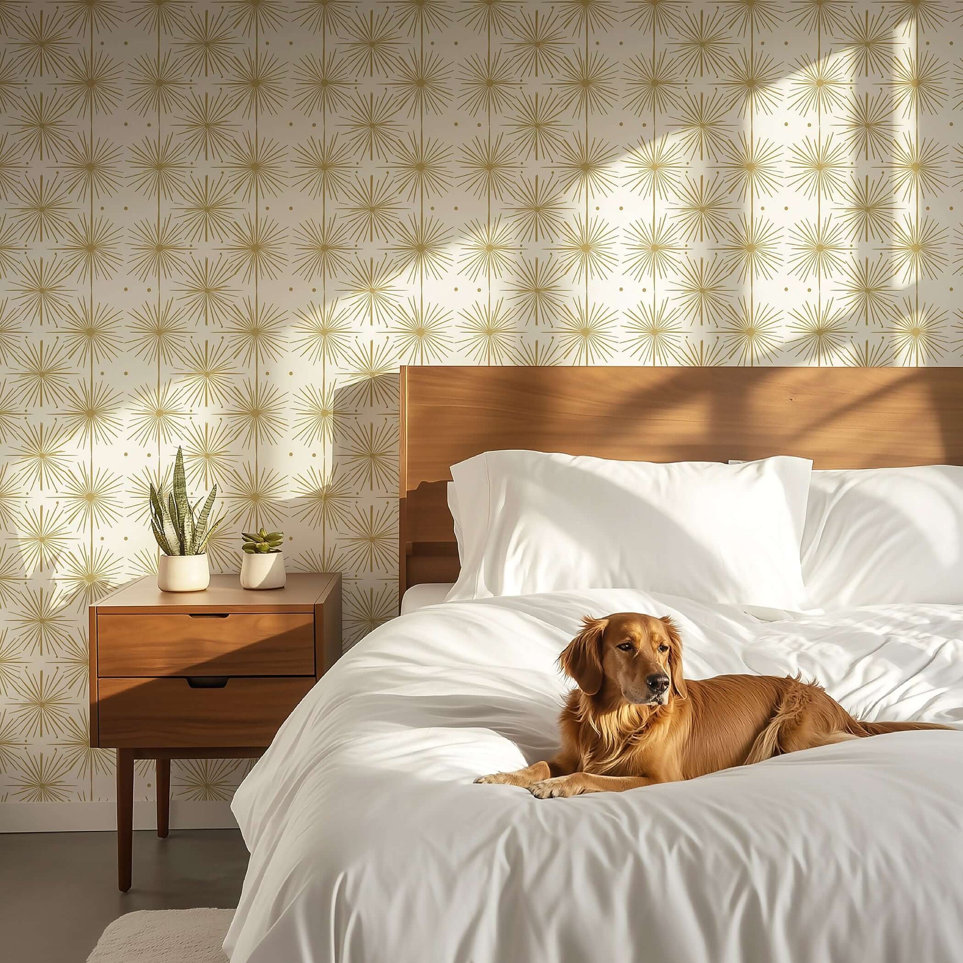 Art Deco gold wallpaper with mid-century starburst design in a bedroom featuring wooden furniture and a relaxed dog on the bed.