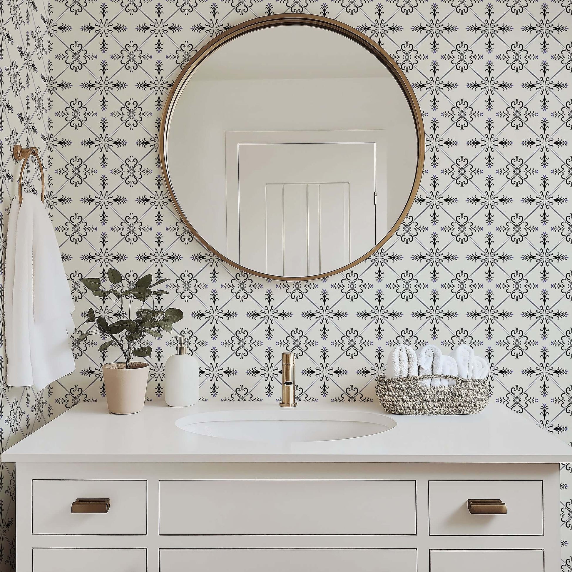 Bathroom with Gothic Revival geometric tile wallpaper, round mirror, and white vanity, combining black, ivory, and violet accents.