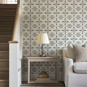 Gothic Revival wallpaper with geometric black and ivory design inspired by European tilework, adding elegance to home decor.