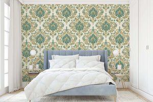 Bedroom with Enchanted Estate wallpaper featuring teal and gold damask design, creating a vintage, elegant atmosphere.