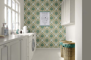 Enchanted Estate wallpaper in laundry room, showcasing teal and gold damask print for vintage elegance.