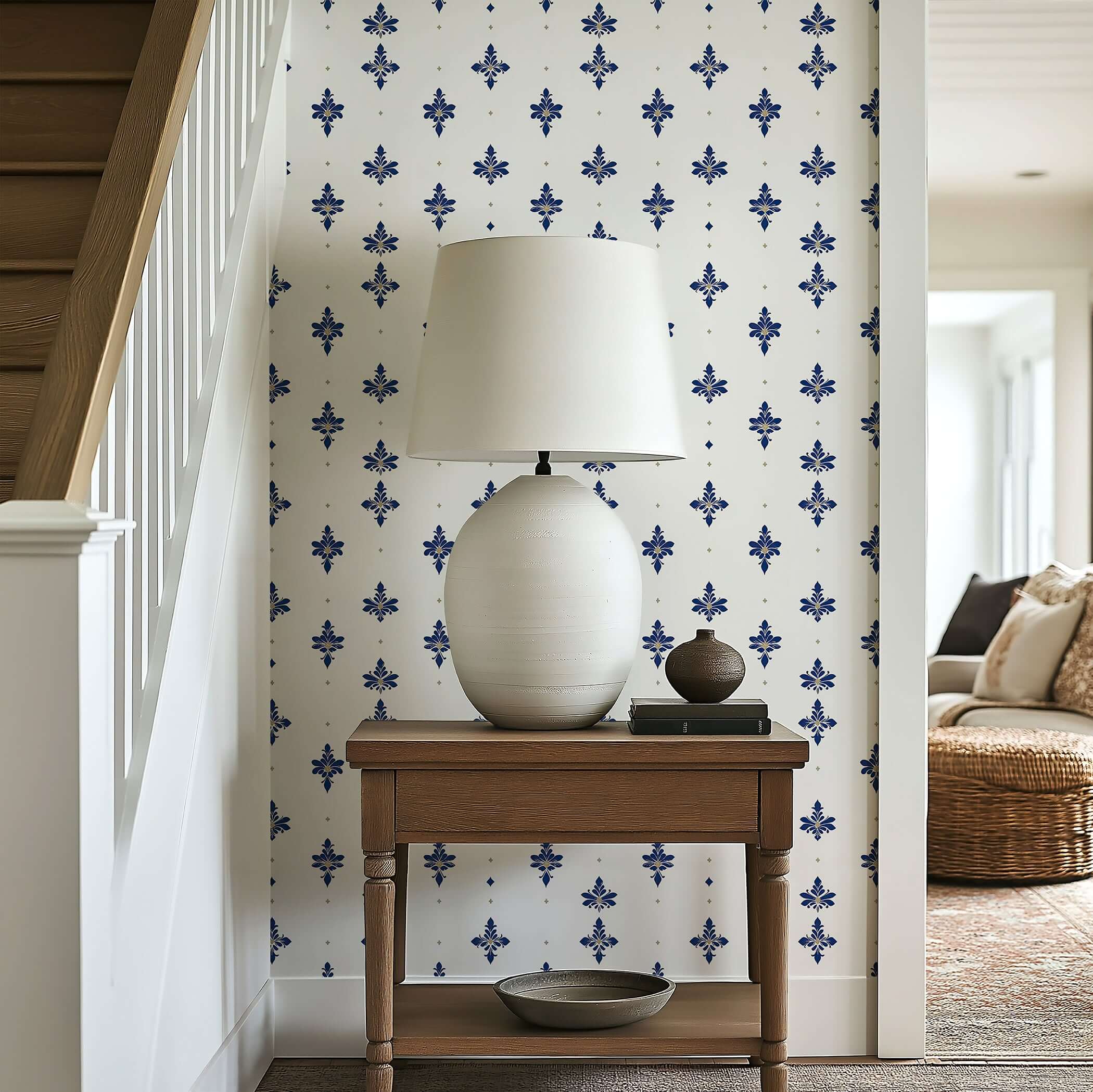 Elegant room featuring Navy Luxe Fleur wallpaper with navy fleur-de-lis pattern, accented by a classic lamp on a wooden table.