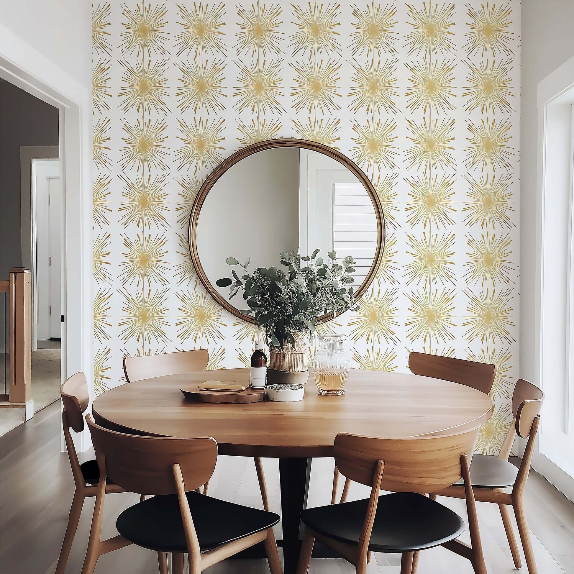 Mid-Century Modern dining area with Gilded Fireworks wallpaper, featuring metallic gold starburst pattern adding retro glamour.