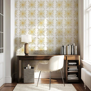 Mid-Century Modern Gilded Fireworks wallpaper with metallic gold starburst design on white, enhancing a retro-themed room.