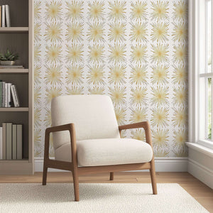 Mid-Century Modern living room with Gilded Fireworks wallpaper, featuring metallic gold starburst design on white background, retro style.