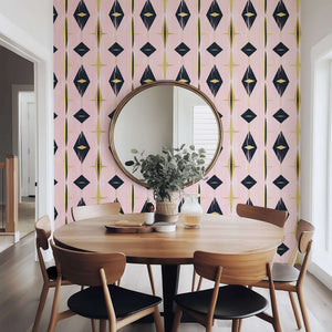 Dining area with Mid-Century Modern wallpaper featuring geometric diamonds in black, gold, and pink, enhancing retro decor.