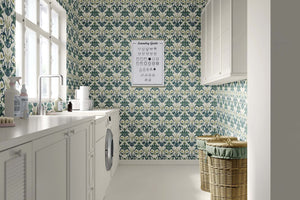 Laundry room with Deep Sea Splendor wallpaper featuring damask marine-inspired design in coastal green tones.