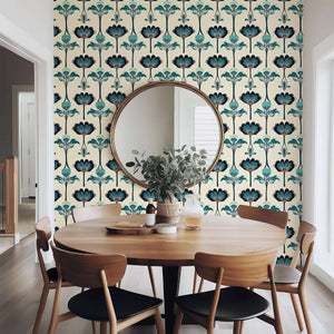 Art Nouveau Botanique wallpaper with teal florals and leaves decorates modern dining room wall, reflecting classic elegance.