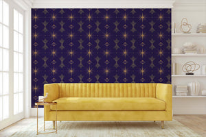 Art Deco wallpaper with golden geometric patterns in a living room featuring a yellow sofa, showcasing elegant and contemporary design.