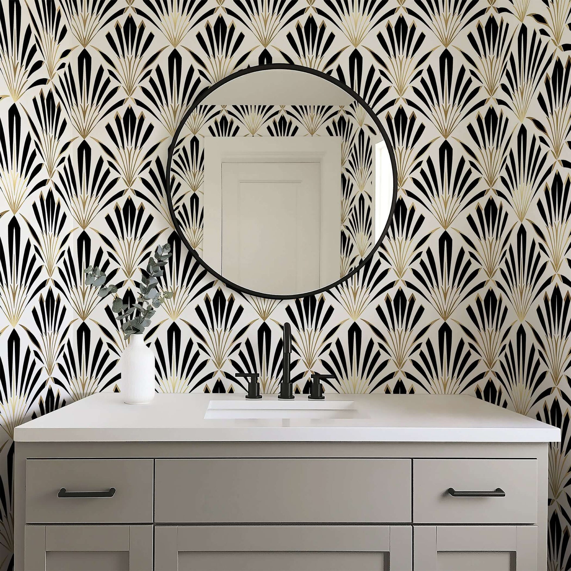 Art Deco geometric wallpaper with black, white, and gold fan motifs in a stylish bathroom setting.