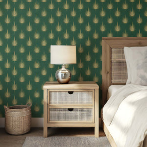 Gilded Palm Luxury Wallpaper with golden palm leaves on a deep green Art Deco background, enhancing a bedroom's elegant decor.