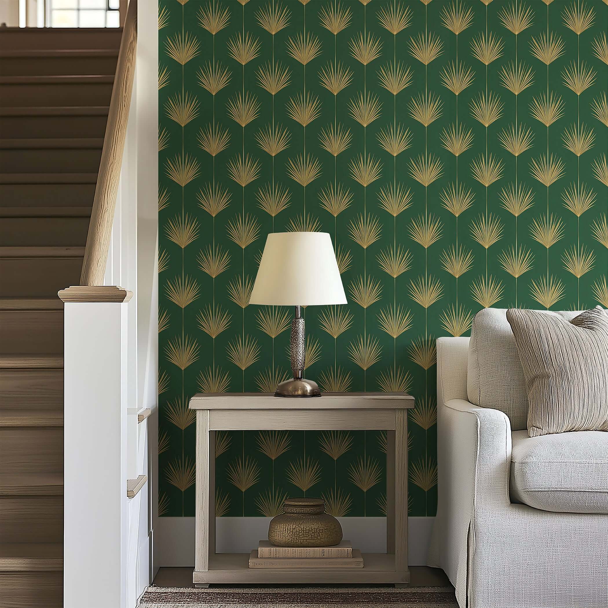 Gold Leaf Tropics Art Deco wallpaper with gold palm leaves and green background in a cozy living room setting.