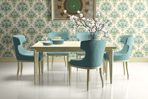 Dining room with teal damask wallpaper, teal chairs, and a tan table set, showcasing timeless elegance and vintage style.