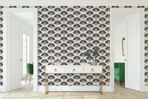 Art Deco wallpaper with black and gold geometric fan motifs on a white background enhances the elegance of a modern interior space.