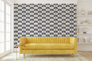 Art Deco wallpaper with black fan motifs and golden highlights, enhancing a modern room's elegance and vintage geometric design.