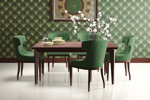 Art Deco dining room featuring Jazz Age Emerald Palm wallpaper, with green chairs and a wooden table, showcasing vintage design elegance.