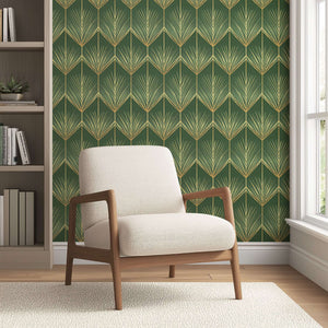 Green and gold Art Deco wallpaper with golden palm fronds, complementing a modern beige armchair in a stylish interior setting.